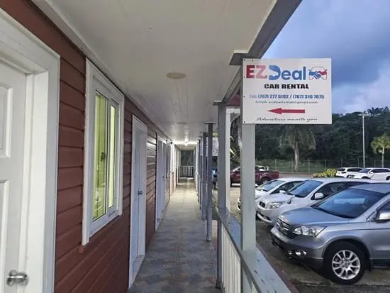 EZ Deal Car Rental office and vehicles at Douglas-Charles Airport